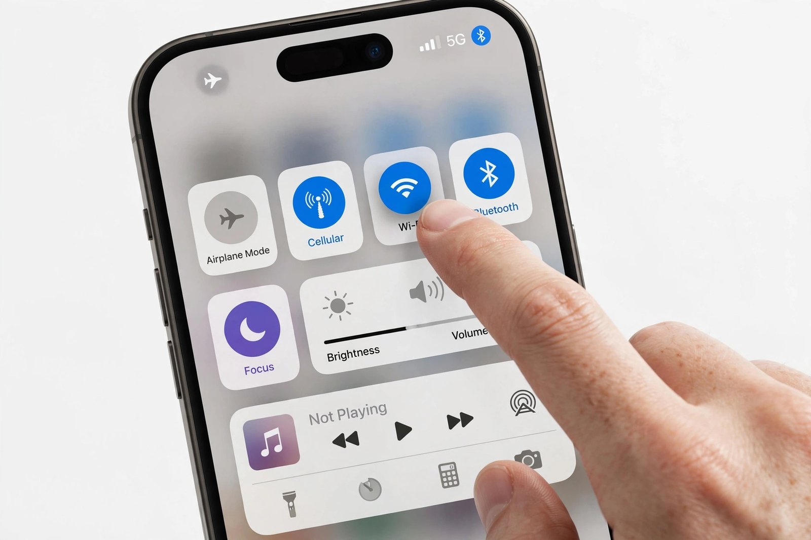 A hand tapping through the iPhone Control Center tiles on the device screen